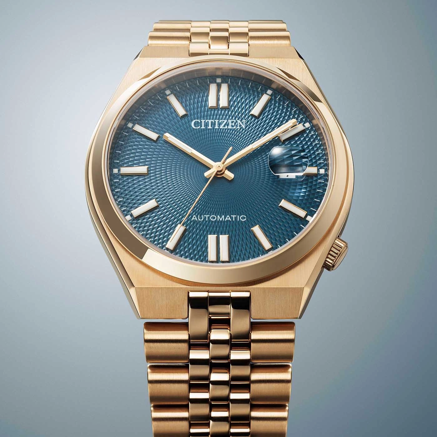 Gouden Citizen horloge met blauwe wijzerplaat en automatisch uurwerk, elegant design.