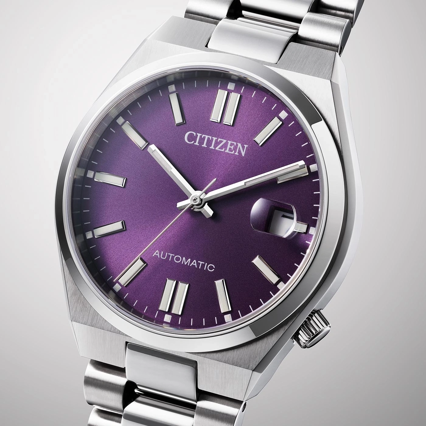 Citizen horloge met paarse wijzerplaat en zilveren band, automatisch uurwerk.