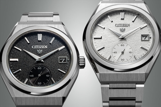 Twee Citizen horloges met getextureerde wijzerplaten en datumweergave, elegant design.