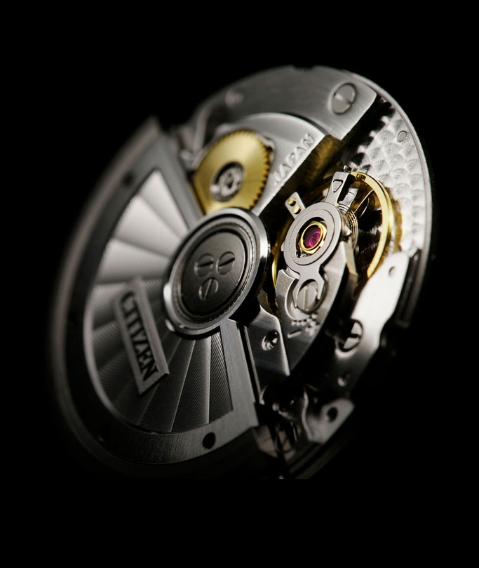 Close-up van een Citizen horlogemechanisme met ingewikkelde details en tandwielen.