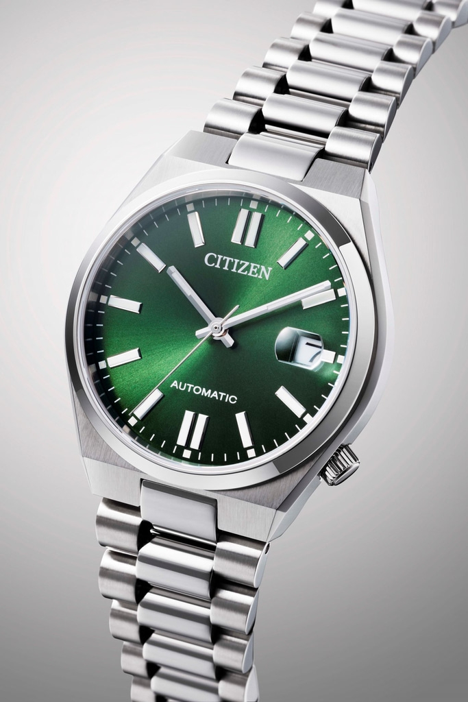 Citizen horloge met groene wijzerplaat en zilveren band, automatisch uurwerk.