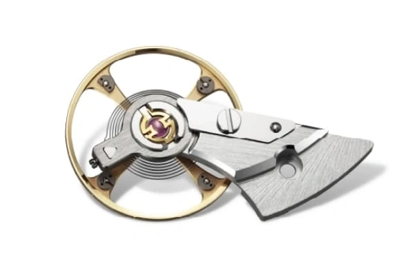 Close-up van een horloge-ankermechanisme met ingewikkelde details en ontwerp.