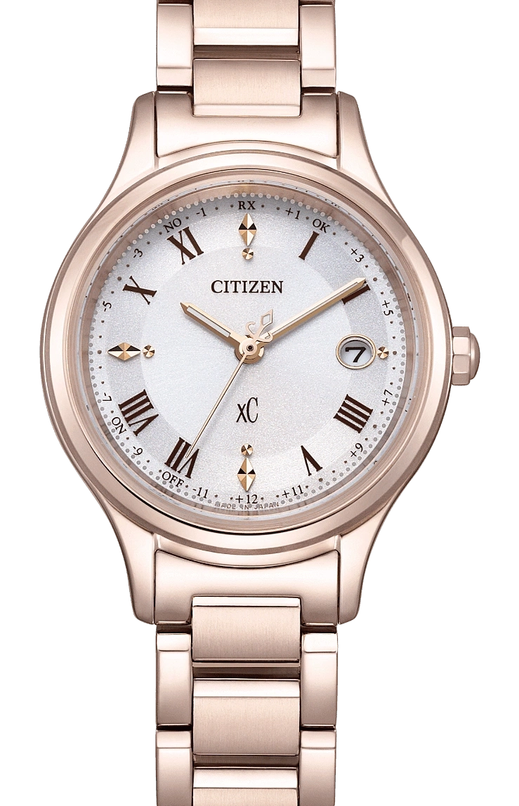Citizen XC horloge met roségouden band en witte wijzerplaat, datumweergave.