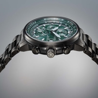 Citizen horloge met groene wijzerplaat en zwarte band, close-up, uurwerk